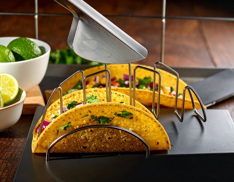 Chef removing center piece from Mi Taco Stand stainless steel taco shell shaper for perfectly crispy taco shells. 