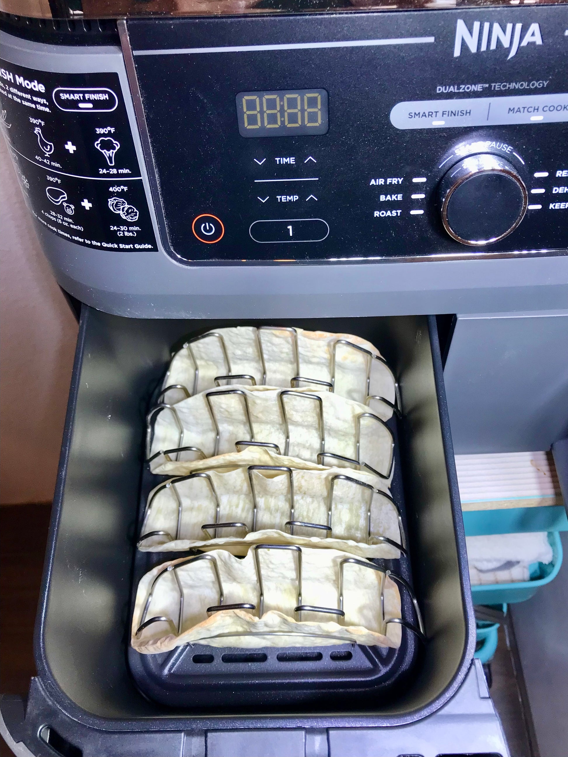 Mi Taco Stand taco stand in ninja air fryer making crunchy taco shells at home.